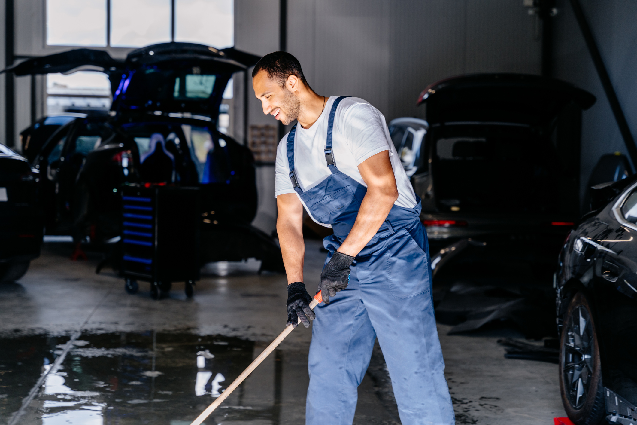 Worker cleaning at a carwash