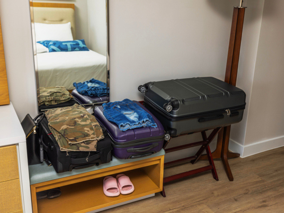 ersonal belongings and luggage organized inside a residential room