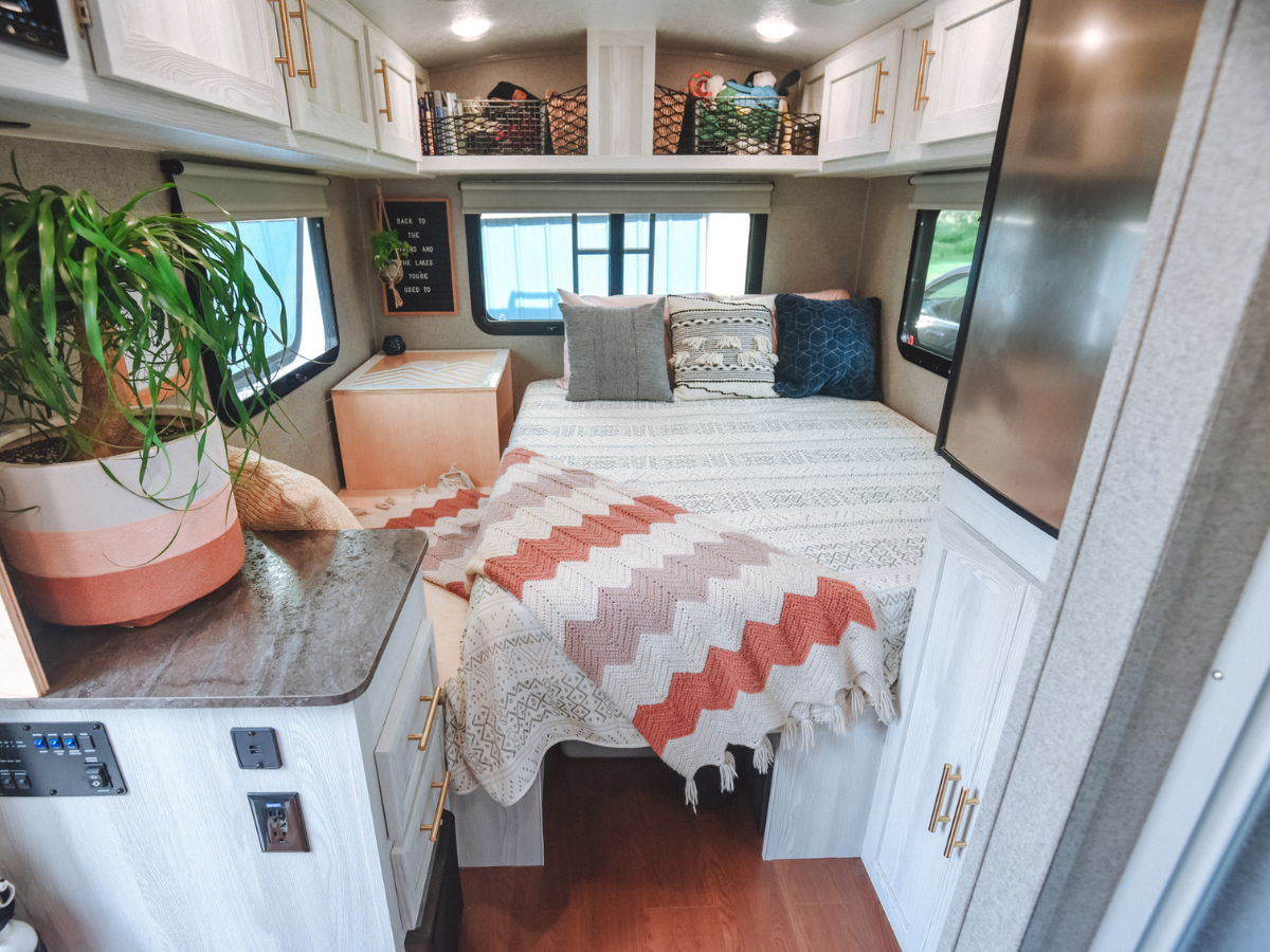 Well-organized sleeping area with overhead storage and comfortable accommodations for Camp trips