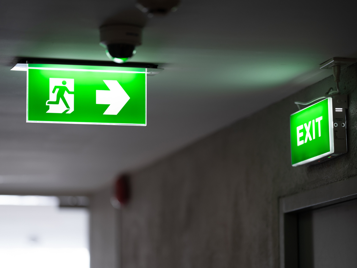 Emergency exit signage in a residential building to guide occupants during Condo Fires.