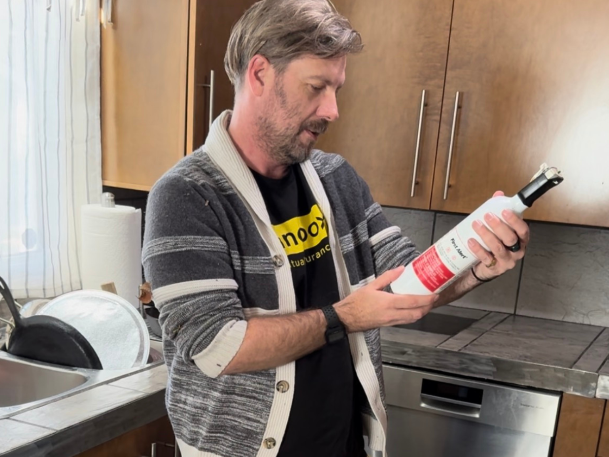 Loss control consultant looking at fire extinguisher