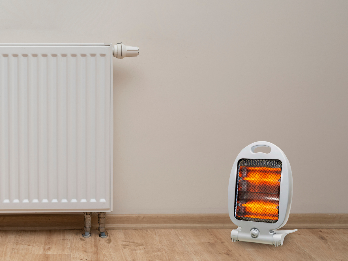 Portable space heater operating near a wall