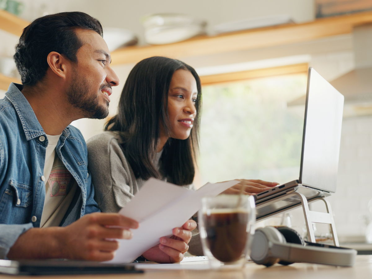 Two people reading the FAQs of our Customer Care Centre