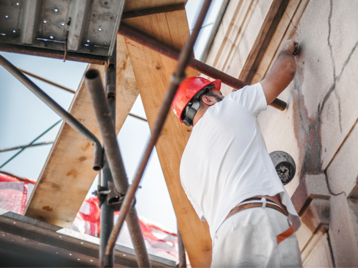 Contractor with equipment for siding homes