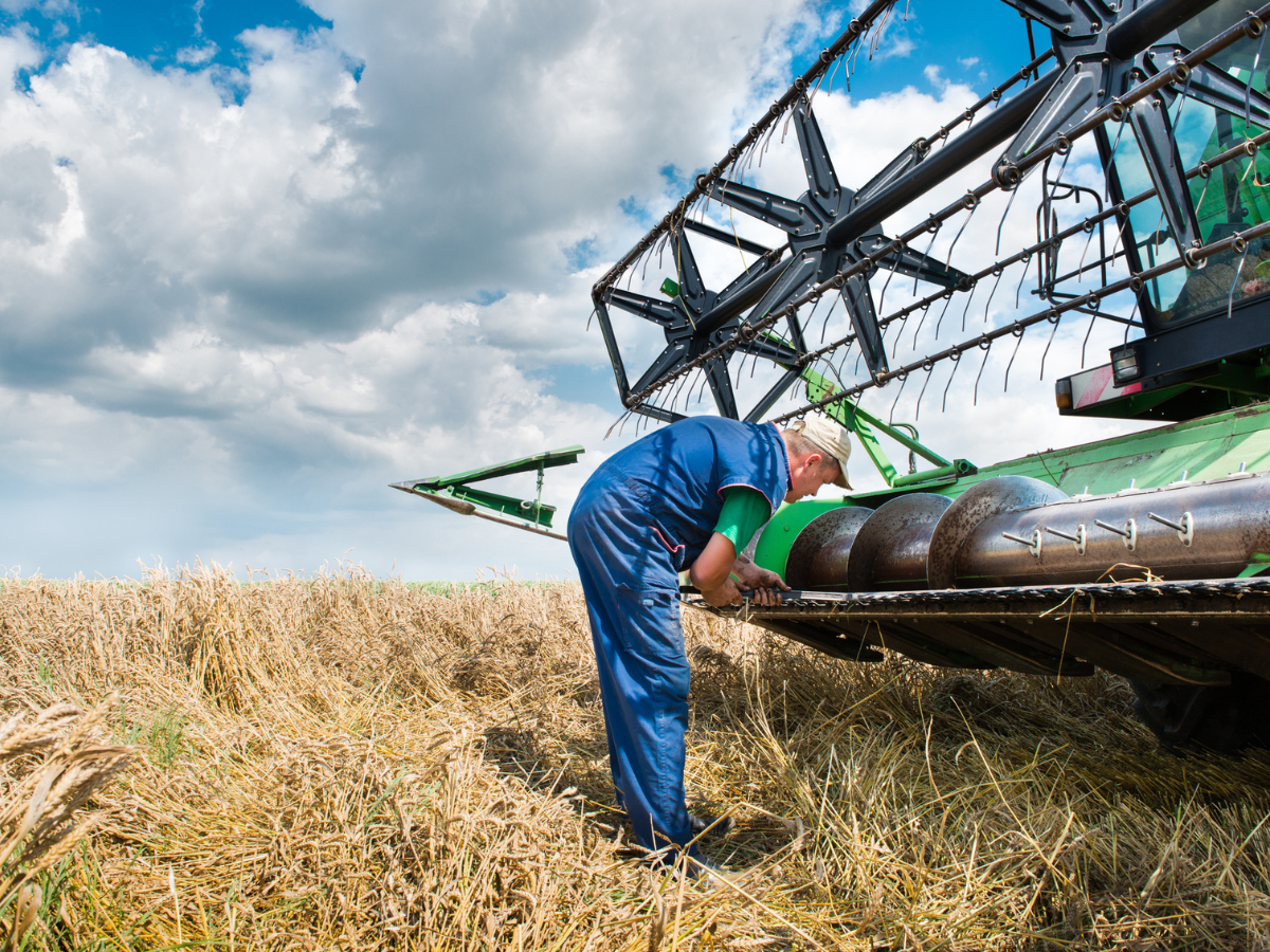 A farmer marking and registering his combine equipment