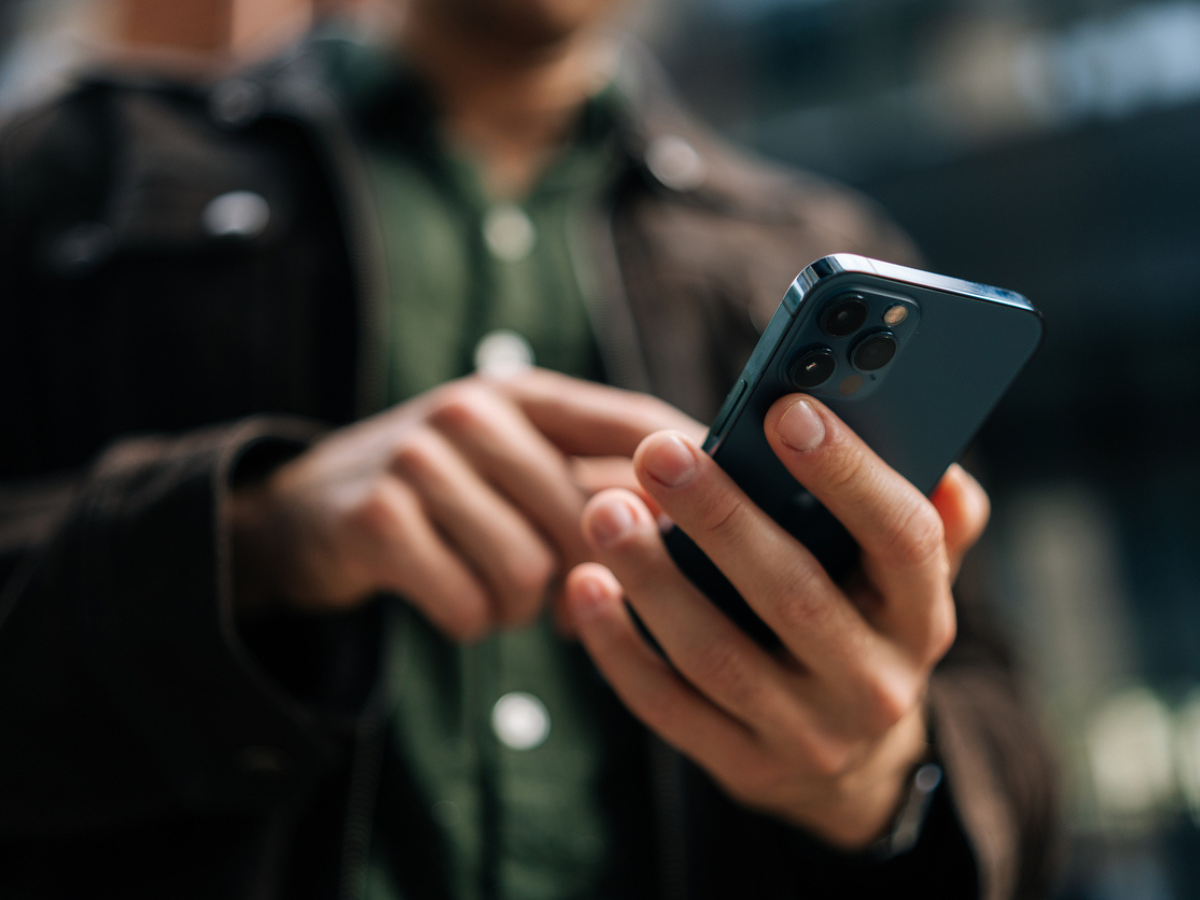 Policyholder reviewing claim details and coverage information on a smartphone