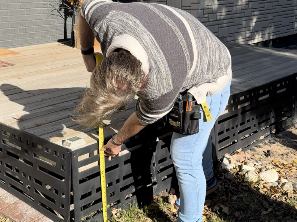 Loss control consultant measuring deck