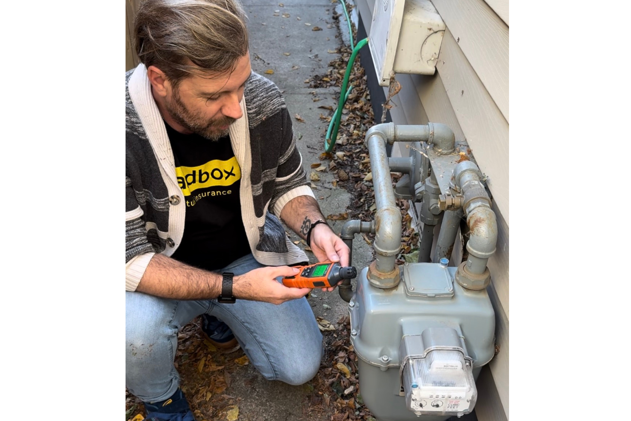 Loss control consultant checking gas meter