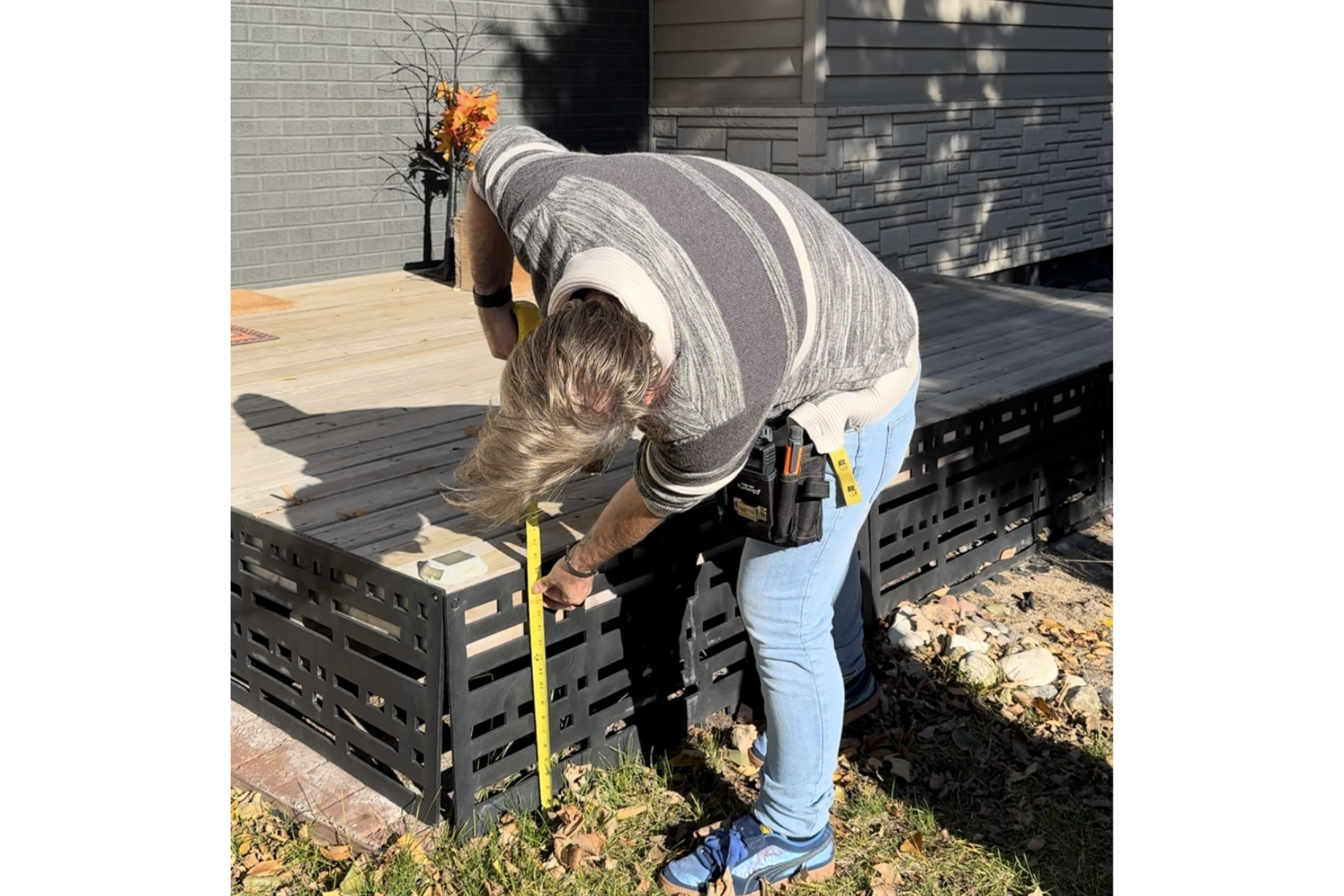 Loss control consultant measuring deck