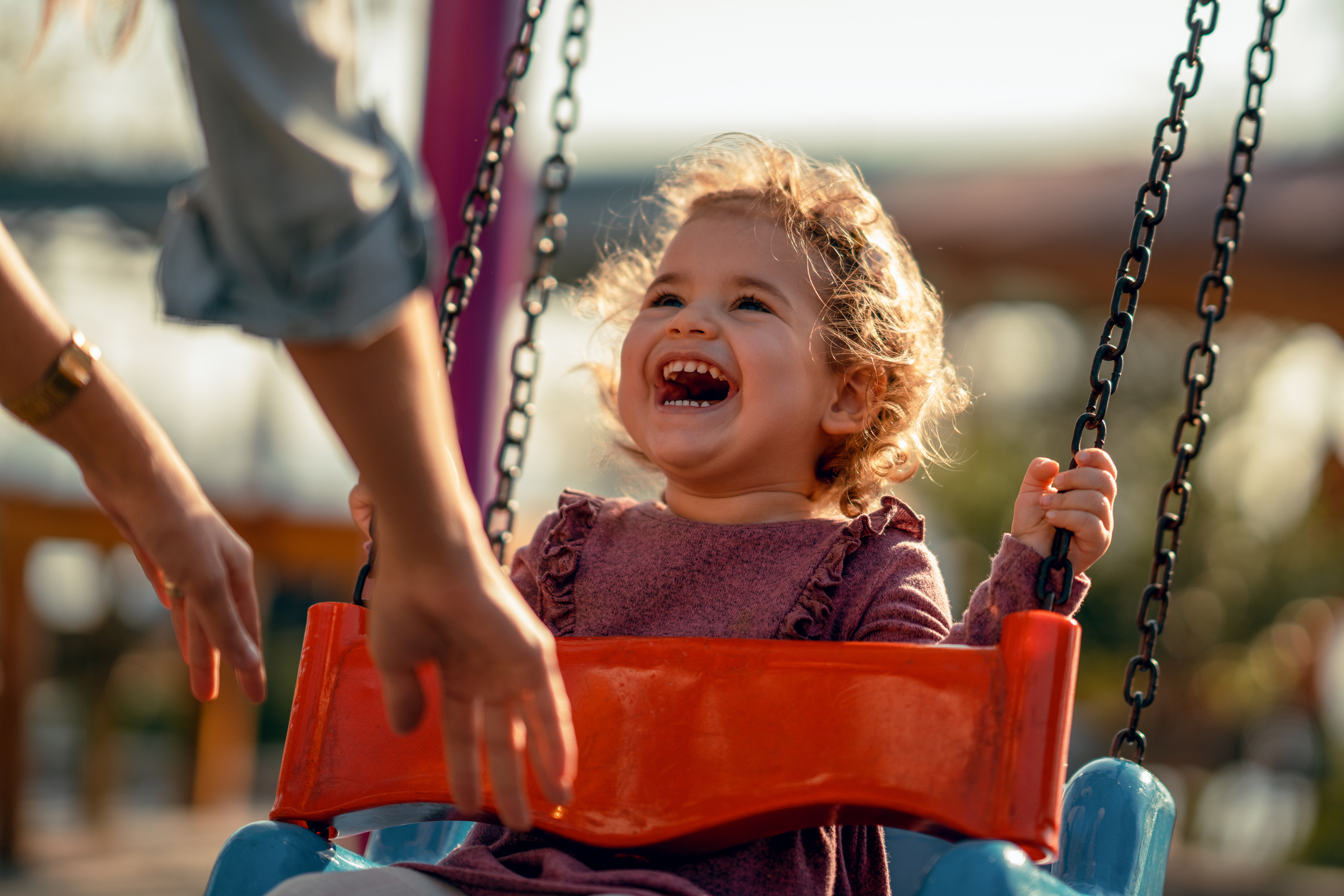 Child on playground swing