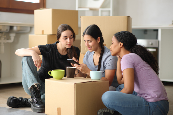 A group of tenants researching tenant insurance coverage in Saskatchewan, Manitoba, and Alberta