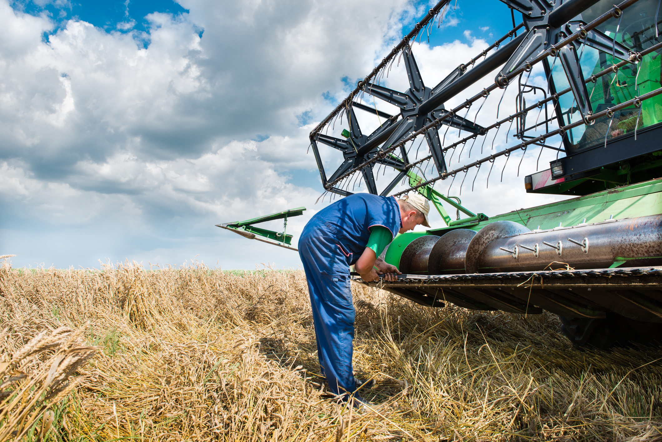 A farmer marking and registering his combine equipment