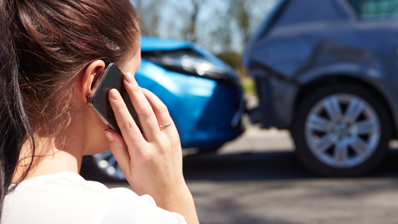 Woman on Phone by car accident