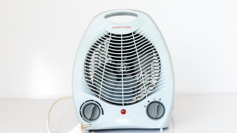 a small white space heater on a white background