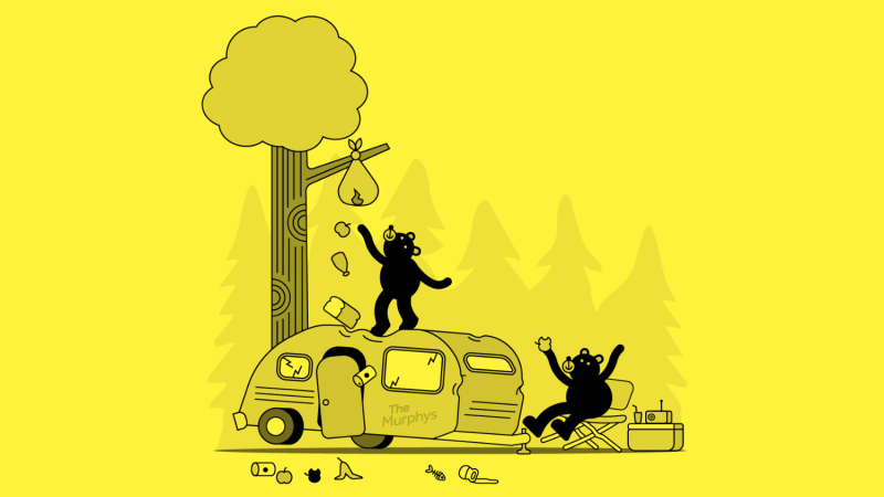 Bears cause havoc by climbing on trailer while reaching for garbage in a tree