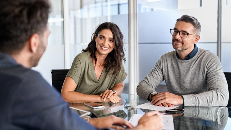 people talking to their sandbox broker about updating their home insurance policy