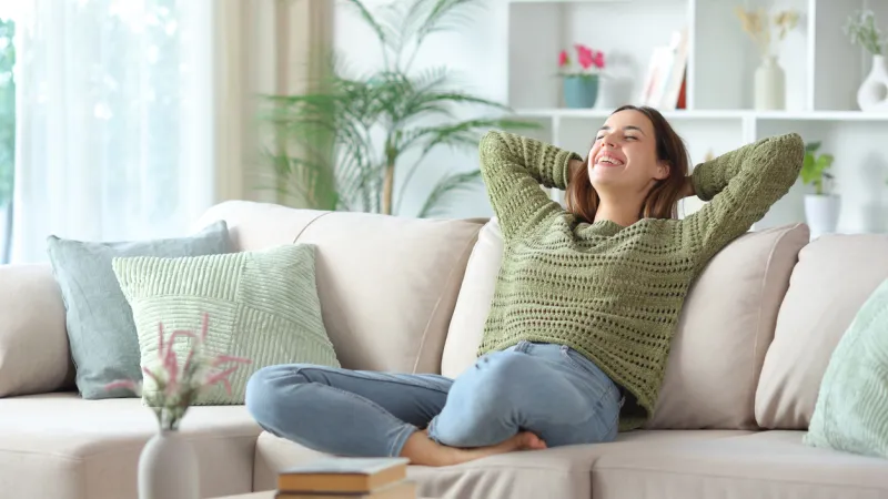 Girl moved into a new condo, feeling refreshed and happy after getting tenant insurance with Sandbox Mutual Insurance