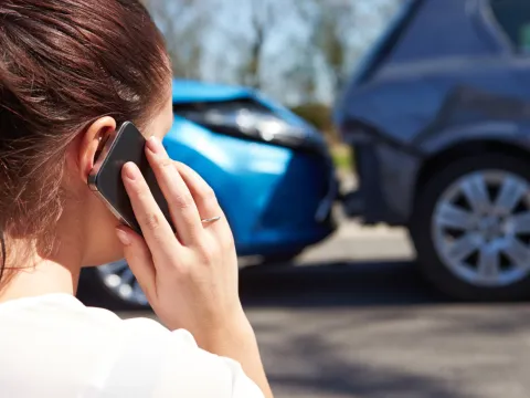 Woman on Phone by car accident