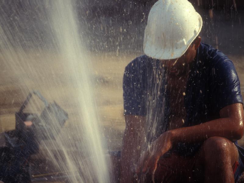 Plumber working on a broken pipe