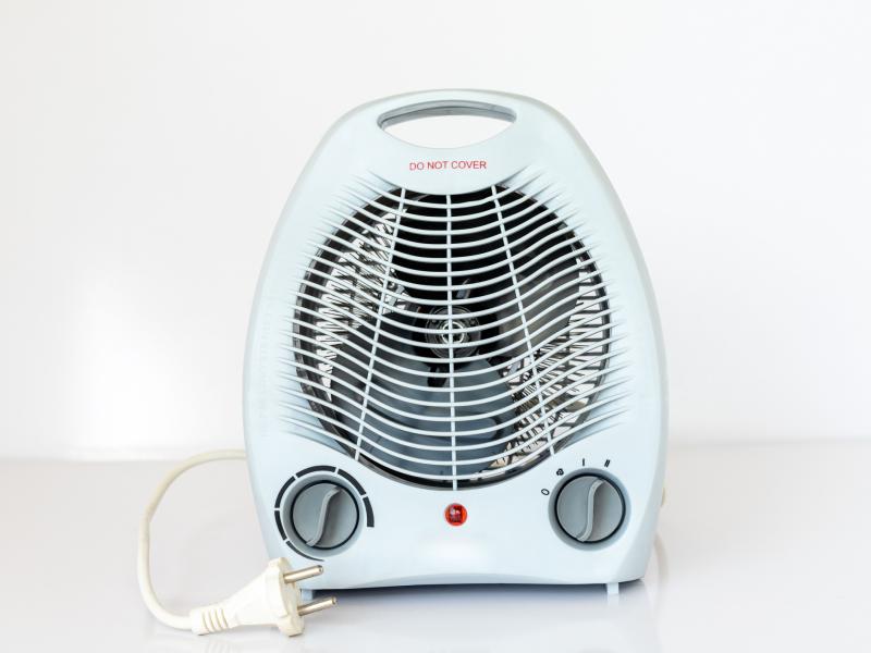 a small white space heater on a white background