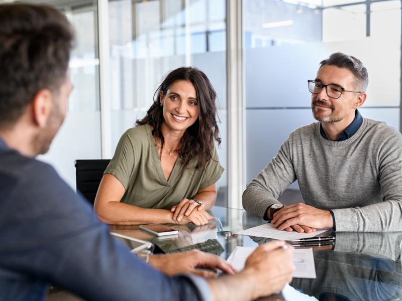 people talking to their sandbox broker about updating their home insurance policy