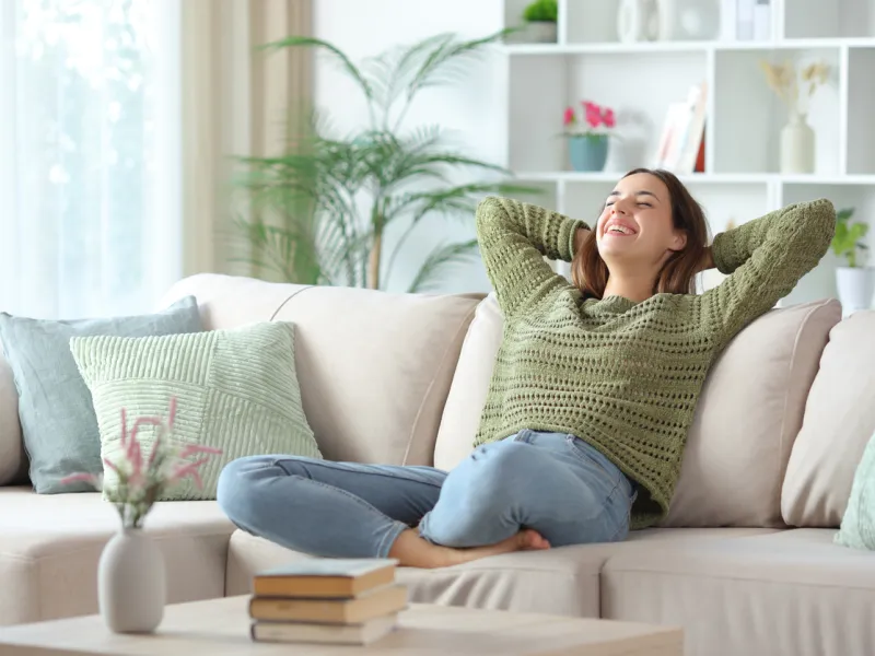 Girl moved into a new condo, feeling refreshed and happy after getting tenant insurance with Sandbox Mutual Insurance